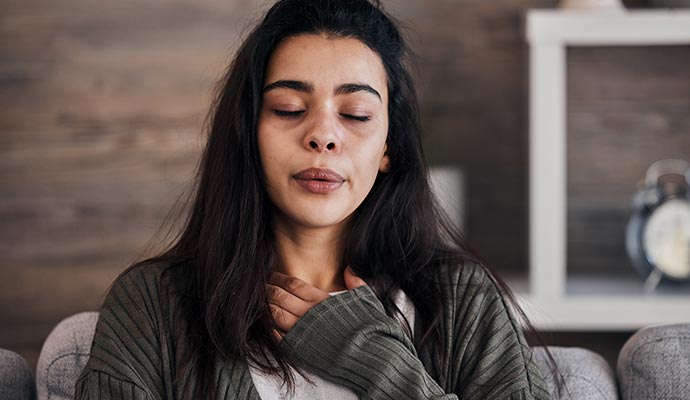 Woman experiencing health issues due to rodent waste Woman experiencing health issues due to rodent waste