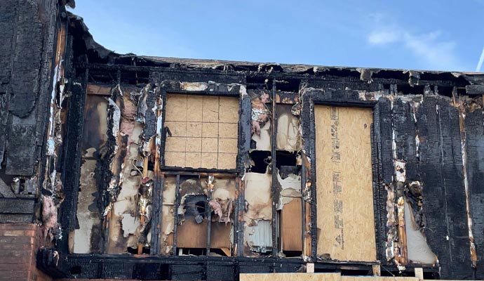 Fire damaged house A house severely damaged by fire