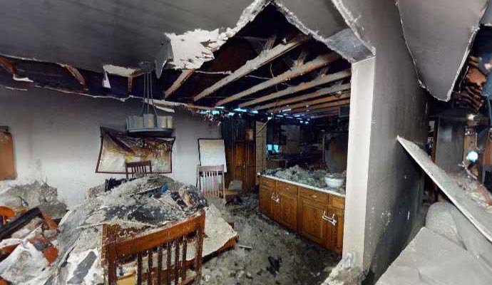 Fire damaged room Room severely damaged by fire