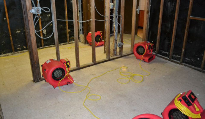 dehumidifiers setup to dry-up the space